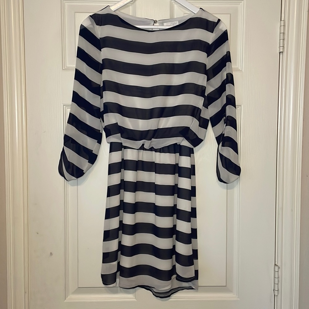 Charming Charlie navy and white stripped dress. Knee length. Pearl button accent